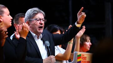 Jean-Luc Melenchon, leader of French far-left opposition party La France Insoumise (France Unbowed - LFI), delivers a speech on stage during a rally with members of the alliance of left-wing parties called the "Nouveau Front Populaire" (New Popular Front - NFP), at the Place de la Republique after partial results in the first round of the early French parliamentary elections in Paris, France, June 30, 2024. REUTERS/Fabrizio Bensch