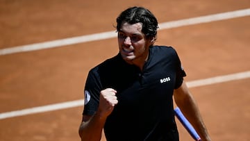 USA's Taylor Fritz celebrates after winning his match against Bulgaria's Grigor Dimitrov at the Men's ATP Rome Open tennis tournament at Foro Italico in Rome on May 14, 2024. (Photo by Filippo MONTEFORTE / AFP)