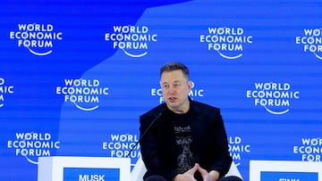 FILE PHOTO: Elon Musk attends the 56th annual World Economic Forum (WEF) meeting in Davos, Switzerland, January 22, 2026. REUTERS/Denis Balibouse/File Photo
