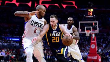 LOS ANGELES, CA - APRIL 18: Gordon Hayward #20 of the Utah Jazz drives to the basket on Marreese Speights #5 and Luc Mbah a Moute #12 of the LA Clippers during a 99-91 Clippers win in Game Two of the Western Conference Quarterfinals during the 2017 NBA Playoffs at Staples Center on April 18, 2017 in Los Angeles, California. NOTE TO USER: User expressly acknowledges and agrees that, by downloading and or using this photograph, User is consenting to the terms and conditions of the Getty Images License Agreement. Harry How/Getty Images/AFP
== FOR NEWSPAPERS, INTERNET, TELCOS & TELEVISION USE ONLY ==