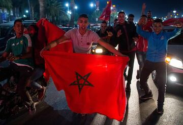 Locals celebrate in Marrakech after Morocco's victory over Ivory Coast in their FIFA 2018 World Cup Play-Off.