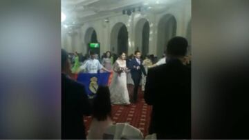 Chinese bride and groom enter wedding reception to rousing sounds of Real Madrid anthem