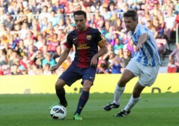 Barcelona - Málaga. Xavi y Toulalan.