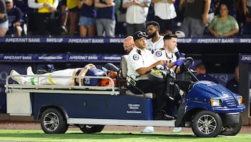 TAMPA, FLORIDA - JUNE 19: Junior Caminero #13 looks on as Hunter Bigge #43 of the Tampa Bay Rays is carted off after getting hit by a foul ball off the bat of Adley Rutschman of the Baltimore Orioles (not pictured) in the seventh inning at George M. Steinbrenner Field on June 19, 2025 in Tampa, Florida. Julio Aguilar/Getty Images/AFP (Photo by Julio Aguilar / GETTY IMAGES NORTH AMERICA / Getty Images via AFP)