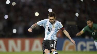 Argentina's Lionel Messi takes a penalty to score against Bolivia during the Russia 2018 FIFA World Cup South American Qualifiers' football match in Cordoba, Argentina, on March 29, 2016. AFP PHOTO / JUAN MABROMATA