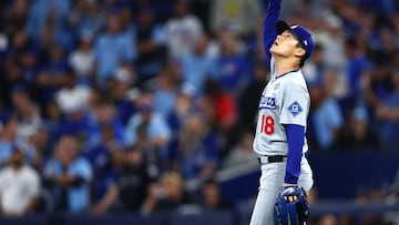 TORONTO, ONTARIO - OCTOBER 25: Yoshinobu Yamamoto #18 of the Los Angeles Dodgers reacts to a pop fly for the third out to defeat the Toronto Blue Jays 5-1 in game two of the 2025 World Series at Rogers Center on October 25, 2025 in Toronto, Ontario. Vaughn Ridley/Getty Images/AFP (Photo by Vaughn Ridley / GETTY IMAGES NORTH AMERICA / Getty Images via AFP)