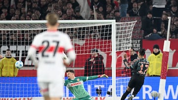 Bayern Munich's French midfielder #17 Michael Olise (R) scores a goal past Stuttgart's German goalkeeper #33 Alexander Nuebel (L) during the German first division Bundesliga football match between VfB Stuttgart and FC Bayern Munich in Stuttgart, southwestern Germany on February 28, 2025. (Photo by THOMAS KIENZLE / AFP) / DFL REGULATIONS PROHIBIT ANY USE OF PHOTOGRAPHS AS IMAGE SEQUENCES AND/OR QUASI-VIDEO