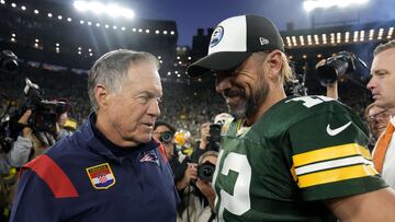 GREEN BAY, WISCONSIN - OCTOBER 02: Head coach Bill Belichick of the New England Patriots and Aaron Rodgers #12 of the Green Bay Packers talk after Green Bay's 27-24 win in overtime at Lambeau Field on October 02, 2022 in Green Bay, Wisconsin.   Patrick McDermott/Getty Images/AFP