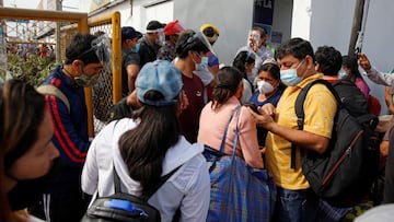People gather outside a bus terminal as Peru's capital Lima, and nine other regions, start a total lockdown at midnight until February 14, following an increase in coronavirus disease (COVID-19) cases, in Lima, Peru January 30, 2021. REUTERS/Sebastian Castaneda