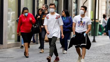 People wear protective face masks due to the coronavirus outbreak, in downtown Granada, Spain March 13, 2020. REUTERS/Jon Nazca