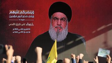 Lebanon's Hezbollah leader Sayyed Hassan Nasrallah appears on a screen as he addresses his supporters during a ceremony to honour fighters killed in the recent escalation with Israel, in Beirut's southern suburbs, Lebanon November 3, 2023. REUTERS/Mohamed Azakir