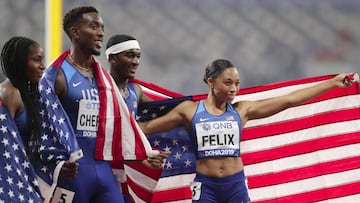 The United States team of Allyson Felix, Wilbert London, Michael Cherry and Courtney Okolo after winning the gold medal in the mixed 4x400 meter relay race at the World Athletics Championships in Doha, Qatar, Sunday, Sept. 29, 2019. (AP Photo/Petr David Josek)