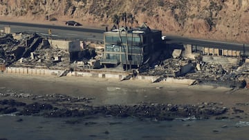 An aerial view shows debris from burned properties, as powerful winds fueling devastating wildfires in the Los Angeles area force people to evacuate, in Malibu, California, U.S. January 10, 2025. REUTERS/Daniel Cole