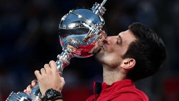 Serbia&#039;s Novak Djokovic kisses the trophy after winning the men&#039;s singles final against John Millman of Australia at the Japan Open tennis tournament in Tokyo on October 6, 2019. (Photo by Behrouz MEHRI / AFP)