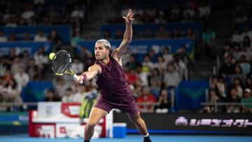 Spain's Carlos Alcaraz hits a return against Belgium's Zizou Bergs during their mens singles match at the ATP Japan Open tennis tournament in Tokyo on September 27, 2025. (Photo by Philip FONG / AFP)