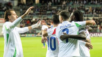 Italy's forward #11 Moise Kean (R) celebrates scoring the opening goal with his teammates during the FIFA World Cup 2026 Group I European qualification football match Estonia vs Italy in Tallinn, Estonia on October 11, 2025. (Photo by RAIGO PAJULA / AFP)
