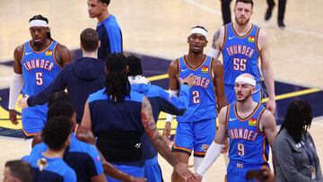 Oklahoma City Thunder players walk to the bench during a timeout in the first quarter against the Indiana Pacers in Game Three of the 2025 NBA Finals at Gainbridge Fieldhouse on June 11, 2025 in Indianapolis, Indiana.