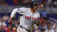 Jul 3, 2024; Miami, Florida, USA; Boston Red Sox third baseman Rafael Devers (11) runs toward third base after hitting an RBI triple against the Miami Marlins during the ninth inning at loanDepot Park. Mandatory Credit: Sam Navarro-USA TODAY Sports