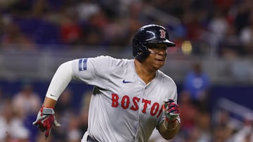 Jul 3, 2024; Miami, Florida, USA; Boston Red Sox third baseman Rafael Devers (11) runs toward third base after hitting an RBI triple against the Miami Marlins during the ninth inning at loanDepot Park. Mandatory Credit: Sam Navarro-USA TODAY Sports