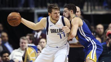 Jan 13, 2019; Dallas, TX, USA; Dallas Mavericks guard Luka Doncic (77) dribbles as Golden State Warriors guard Klay Thompson (11) defends during the second half at American Airlines Center. Mandatory Credit: Kevin Jairaj-USA TODAY Sports