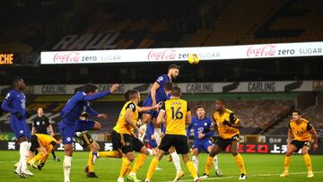 WOLVERHAMPTON, ENGLAND - DECEMBER 15: Olivier Giroud of Chelsea heads at goal during the Premier League match between Wolverhampton Wanderers and Chelsea at Molineux on December 15, 2020 in Wolverhampton, England. The match will be played without fans, be