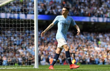 Phil Foden of Manchester City celebrates after scoring his team's first goal during the Premier League match between Manchester City and Tottenham