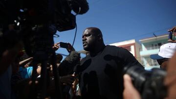 Former NBA basketball star Shaquille O'Neal (C) speaks to journalists before conducting a master class for young people in Havana, Cuba, June 26, 2016. REUTERS/Alexandre Meneghini