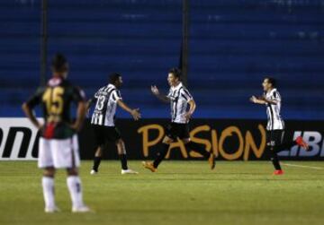 Matias Santos (2nd R) of Uruguay's Wanderers celebrates after scoring a goal against Chile's Palestino during their Copa Libertadores soccer match in Montevideo, March 10, 2015. REUTERS/Andres Stapff (URUGUAY - Tags: SPORT SOCCER)