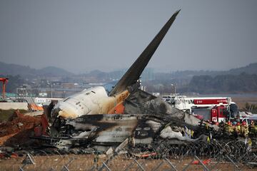 Rescue workers take part in a salvage operation at the site where an aircraft crashed after it went off the runway at Muan International Airport, in Muan, South Korea, December 29, 2024.