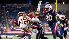 FOXBOROUGH, MA - AUGUST 12: Jonathan Williams #38 of the Washington Football Team is tackled by Harvey Langi #48 of the New England Patriots in the second half at Gillette Stadium on August 12, 2021 in Foxborough, Massachusetts.   Kathryn Riley/Getty Imag