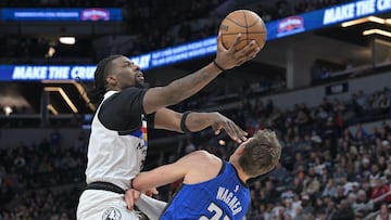 Feb 3, 2023; Minneapolis, Minnesota, USA; Orlando Magic center Moritz Wagner (21) draws a charging foul on Minnesota Timberwolves center Naz Reid (11) during the third quarter at Target Center. Mandatory Credit: Jeffrey Becker-USA TODAY Sports