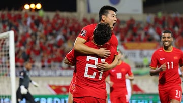 China&#039;s forward Wu Lei celebrates after scoring during the 2022 Qatar World Cup Asian Qualifiers football match between China and Oman, at the Sharjah Football Stadium in the Emirati city, on November 11, 2021. (Photo by Giuseppe CACACE / AFP)