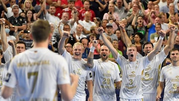 Kiel's players celebrate after winning the EHF Men's Champions League Final Four third place handball match THW Kiel vs Telekom Veszprem HC in Cologne, western Germany on June 19, 2022. (Photo by Roberto Pfeil / AFP)