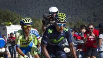 Movistar's Colombian cyclist Nairo Quintana (R) competes followed by Tinkoff Saxo's Polish cyclist Rafal Majka during the 20th Stage of the 2015 Vuelta Espana cycling tour, a 175,8km route between San Lorenzo del Escorial and Cercedilla on September 12, 2015. AFP PHOTO/ JAIME REINA