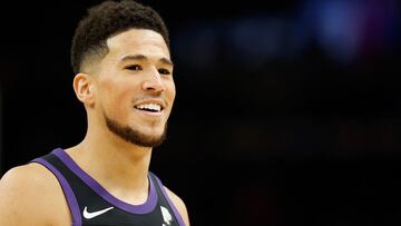 PHOENIX, ARIZONA - MARCH 27: Devin Booker #1 of the Phoenix Suns reacts during the first half of the NBA game against the Philadelphia 76ers at Footprint Center on March 27, 2022 in Phoenix, Arizona. The Suns defeated the 76ers 114-104. NOTE TO USER: User