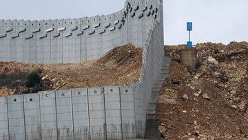 A "Blue Line" marker stands near a concrete wall along Lebanon's southern border which, according to the Lebanese presidency, extends beyond the "Blue Line", a U.N.-mapped line separating Lebanon from Israel and the Israeli-occupied Golan Heights, as seen from northern Israel, November 16, 2025. REUTERS/Shir Torem TPX IMAGES OF THE DAY