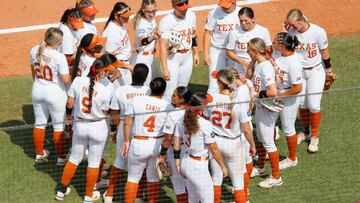 OKLAHOMA CITY, OK - JUNE 4:  The Texas Longhorns huddle in the sixth inning after falling behind the Oklahoma Sooners during the NCAA Women's College World Series at the USA Softball Hall of Fame Complex on June 4, 2022 in Oklahoma City, Oklahoma.   (Photo by Brian Bahr/Getty Images)