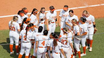 OKLAHOMA CITY, OK - JUNE 4:  The Texas Longhorns huddle in the sixth inning after falling behind the Oklahoma Sooners during the NCAA Women's College World Series at the USA Softball Hall of Fame Complex on June 4, 2022 in Oklahoma City, Oklahoma.   (Photo by Brian Bahr/Getty Images)