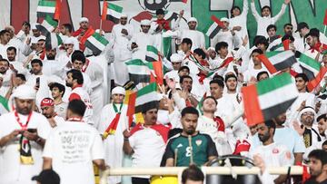 UAE fans wave their flag ahead of the FIFA World Cup 2026 Asia zone qualifiers group A football match between UAE and Qatar at the Al-Nahyan Stadium in Abu Dhabi on November 19, 2024. (Photo by FADEL SENNA / AFP)