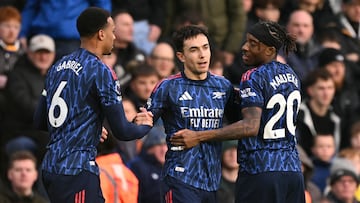 Arsenal's Spanish defender #36 Martin Zubimendi (C) celebrates with Arsenal's Brazilian defender #06 Gabriel Magalhaes (L) and Arsenal's English defender #20 Noni Madueke (R) after scoring the opening goal of the English Premier League football match between Leeds United and Arsenal at Elland Road in Leeds, northern England on January 31, 2026. (Photo by Oli SCARFF / AFP) / RESTRICTED TO EDITORIAL USE. No use with unauthorized audio, video, data, fixture lists, club/league logos or 'live' services. Online in-match use limited to 120 images. An additional 40 images may be used in extra time. No video emulation. Social media in-match use limited to 120 images. An additional 40 images may be used in extra time. No use in betting publications, games or single club/league/player publications. /