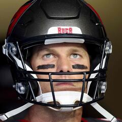 What were Tom Brady's stats at the New England Patriots and how much did he earn there?