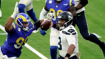 Seattle Seahawks quarterback Russell Wilson (3) throws under pressure from Los Angeles Rams defensive end Aaron Donald (99) during the second half of an NFL football game Sunday, Nov. 15, 2020, in Inglewood, Calif. (AP Photo/Jae C. Hong)