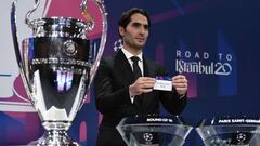 UEFA Champions League&#039;s ambassador Hamit Altintop holds the slip of FC Barcelona during the UEFA Champions League football cup round of 16 draw ceremony on December 16, 2019 in Nyon. (Photo by Fabrice COFFRINI / AFP)