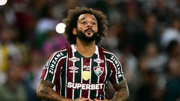 (FILES) Fluminense's defender Marcelo gestures during the Copa Libertadores group stage second leg football match between Brazil's Fluminense and Peru's Alianza Lima at the Maracana Stadium in Rio de Janeiro, Brazil, on May 29, 2024. Left-back Marcelo, 36, ended his contract with Fluminense on November 2, the Rio de Janeiro club said, a day after the defender had a falling out with the team's coach, former Brazil national team manager Mano Menezes. (Photo by Pablo PORCIUNCULA / AFP)