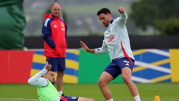 Spain's forward #09 Joselu (L) and Spain's midfielder #06 Mikel Merino (R) compete for the ball during a training session at the team's base camp in Donaueschingen in southern Germany on June 21, 2024, during the UEFA Euro 2024 football championship. (Photo by LLUIS GENE / AFP)
