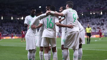 Saudi's forward Abdullah al-Hamdan celebrates his goal with teammates during the 24th Arabian Gulf Cup semi-final football match between Saudi Arabia and Qatar at al-Janoub Stadium in the Qatari capital Doha on December 5, 2019. (Photo by MUSTAFA ABU