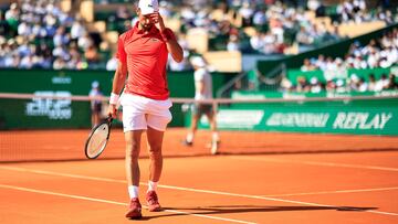 Serbia's Novak Djokovic reacts as he plays against Italy's Lorenzo Musetti during their Monte Carlo ATP Masters Series Tournament round of 16 tennis match on the Rainier III court at the Monte Carlo Country Club on April 11, 2024. (Photo by Valery HACHE / AFP)