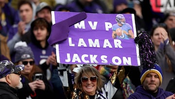 A fan holds up an MVP sign supporting Baltimore Ravens quarterback Lamar Jackson.