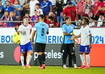 Uruguay's Luis Suárez and Mathias Olivera greet Christian Pulisic and Weston McKennie after Copa América clash.