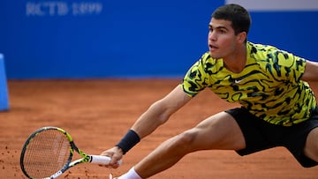 Spain's Carlos Alcaraz returns the ball to Spain's Alejandro Davidovich during the ATP Barcelona Open "Conde de Godo" tennis tournament singles match at the Real Club de Tenis in Barcelona on April 21, 2023. (Photo by Josep LAGO / AFP)